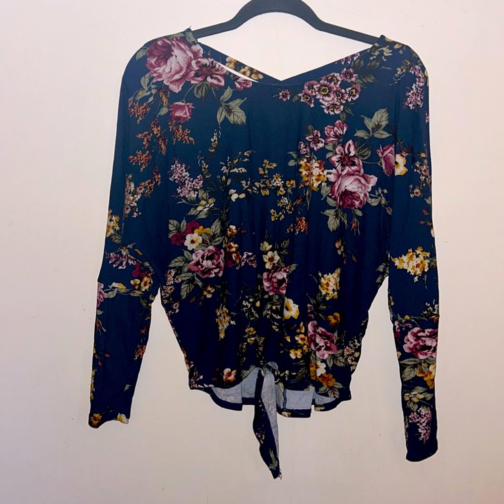 IZ BRYER, beautiful floral top tie bottom and Chris crossed looking back.